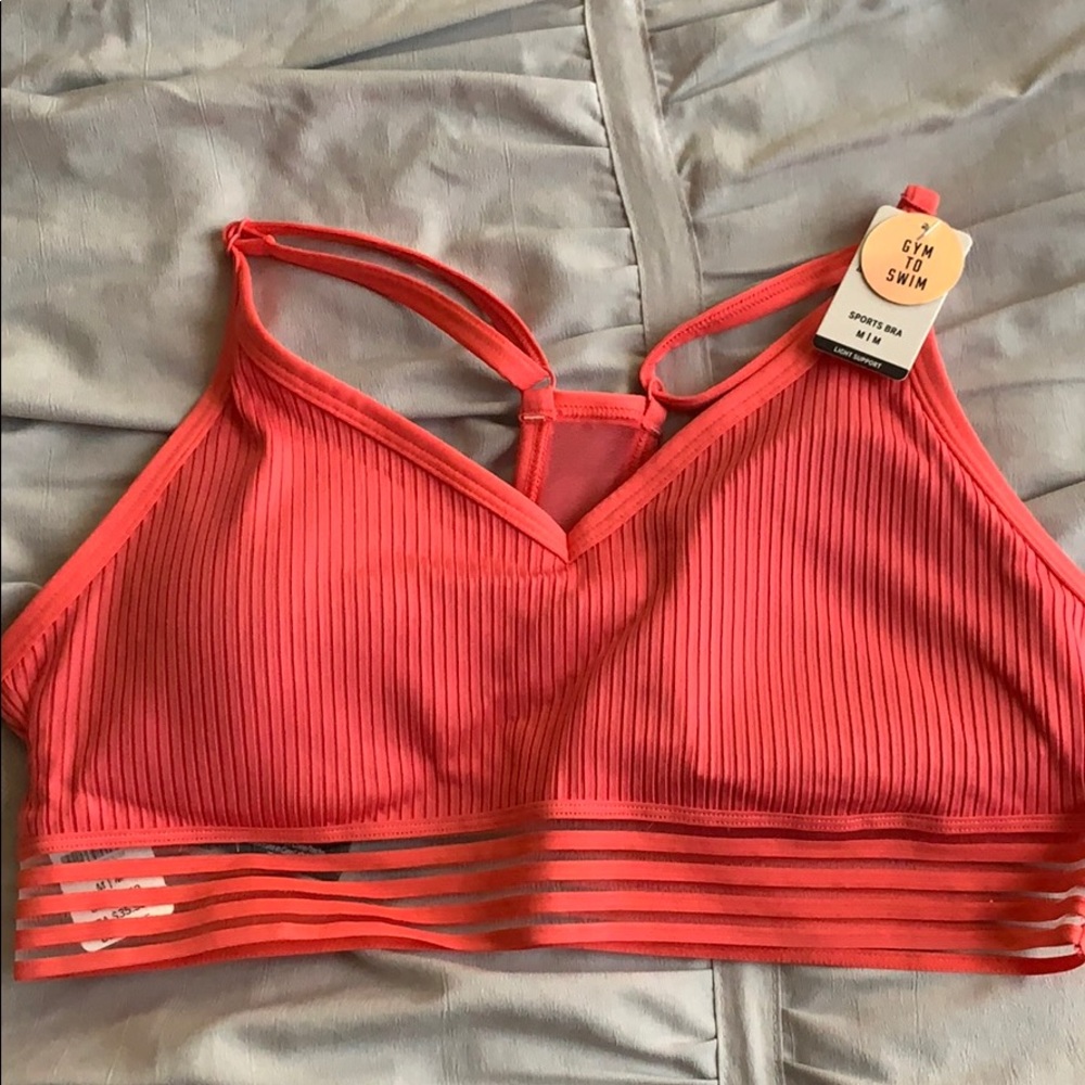 Pink Victoria’s Secret sports bra